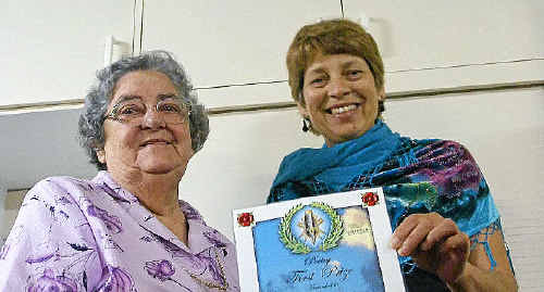 Ellen Mulherin, of Grafton, receives her first place award for poetry from author Valerie Albrecht. Ellen Mulherin, of Grafton, receives her first place award for poetry from author Valerie Albrecht.